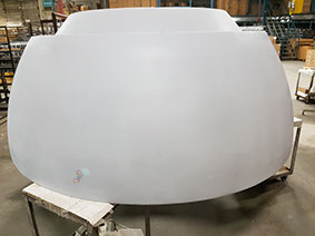 large/oversize light reflector gets surface primed, prepared and sanded for metal topcoat. Vacuum Metallizing Limited jpg