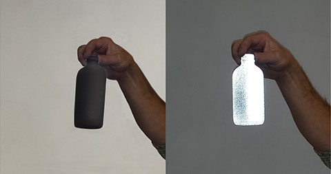 Glass bottle with retro-reflective paint. Increase worksite, night time and low-lighting visibility. Vacuum Metallizing Limited png