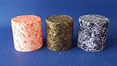 Plastic caps painted with opaque base-coat and various veil/spatter top-coats, including black, white, orange/red, gold, purple/blue . VML jpg