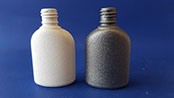 Glass nail polish bottles bottles recieve white and grey liquid topcoat that dreis with a textured finish. Vacuum Metallizing Limited jpg