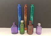 Glass nail polish and perfume bottles painted to have a semi-transparent finish, providing UV protection. Vacuum Metallizing Limited jpg
